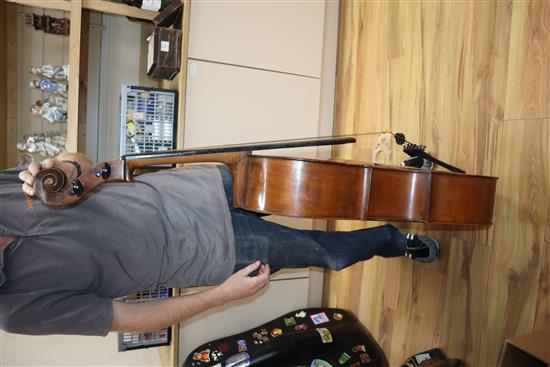 A cased cello with bow